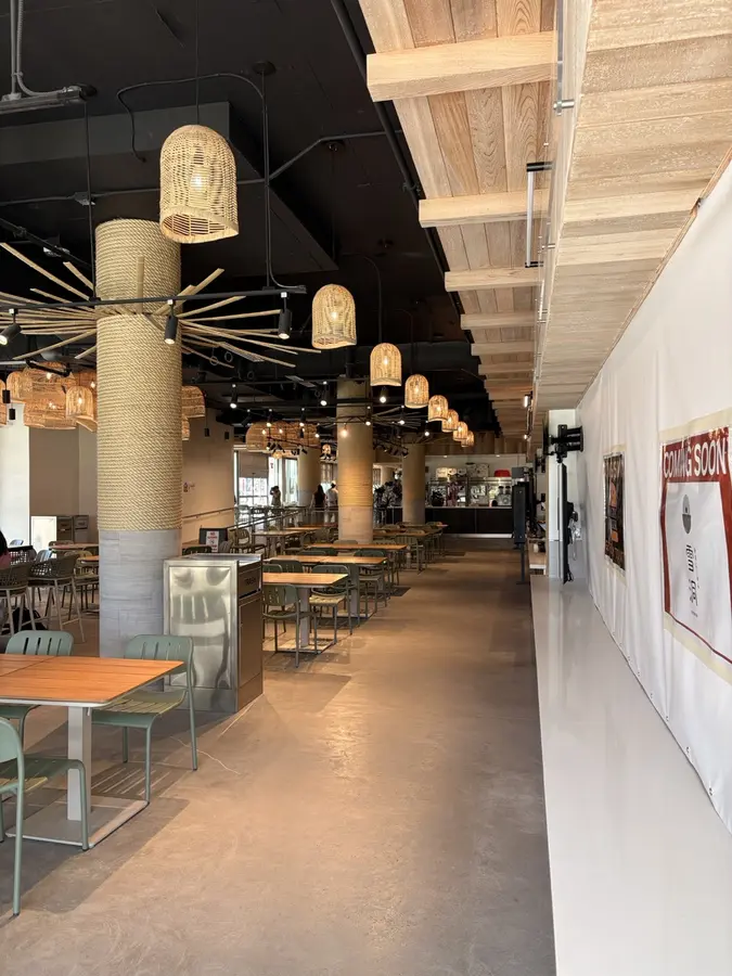 Midtown Eats interior at The Park on Keeaumoku with modern seating and wicker pendant lights