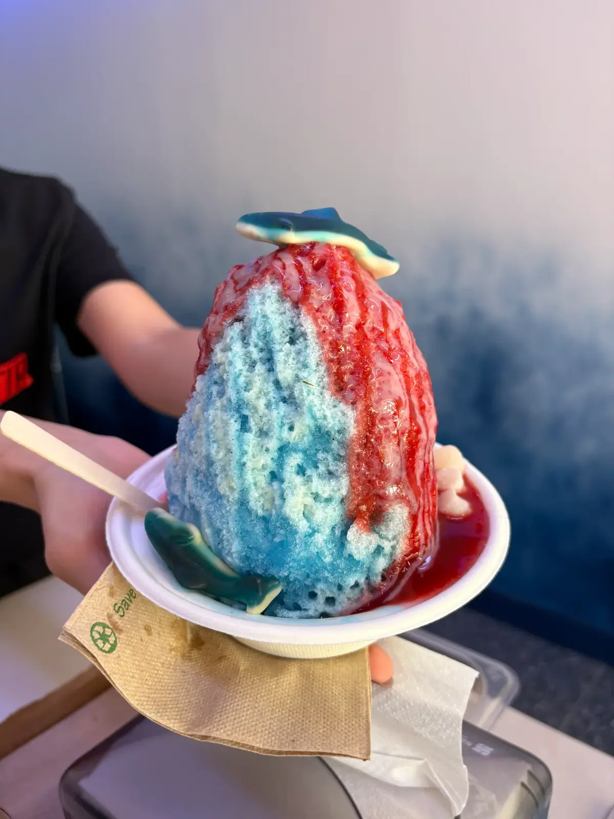 Shark Bait rainbow shave ice with blue vanilla lillikoi strawberry syrups gummy sharks mochi balls from Sin Ice Stir