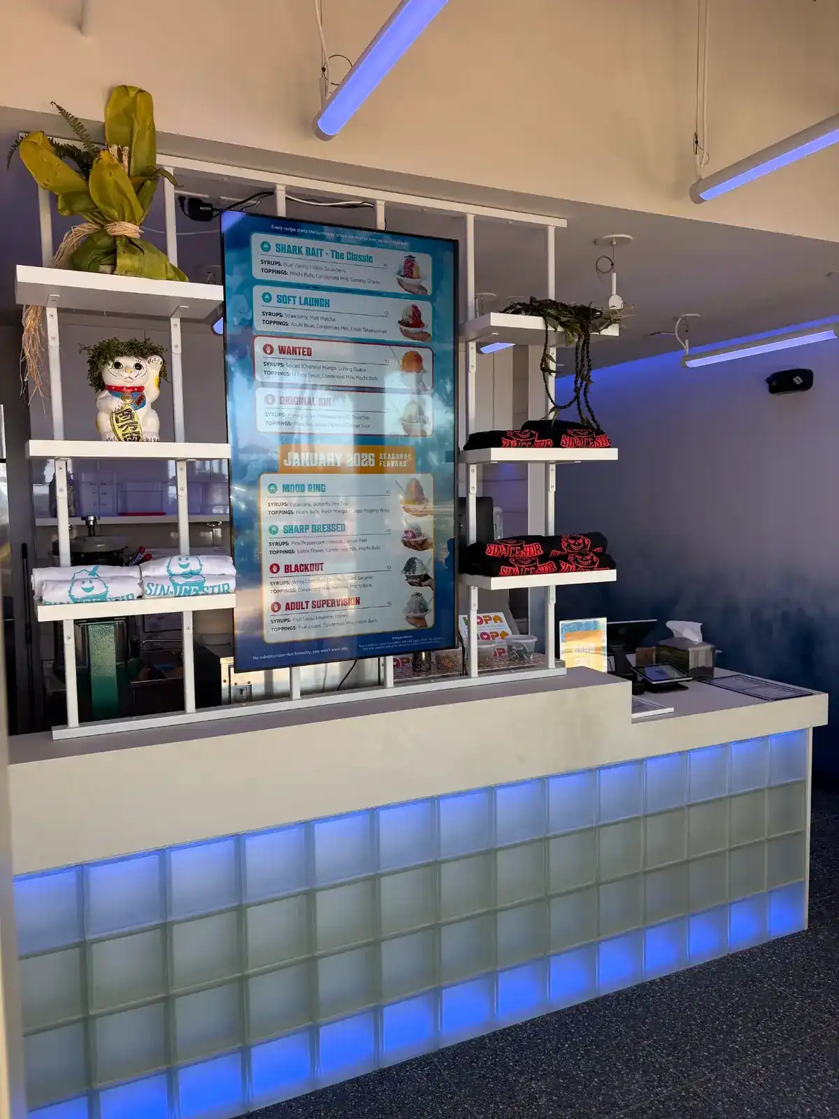 Sin Ice Stir counter with digital menu board showing January 2026 seasonal and classic flavors