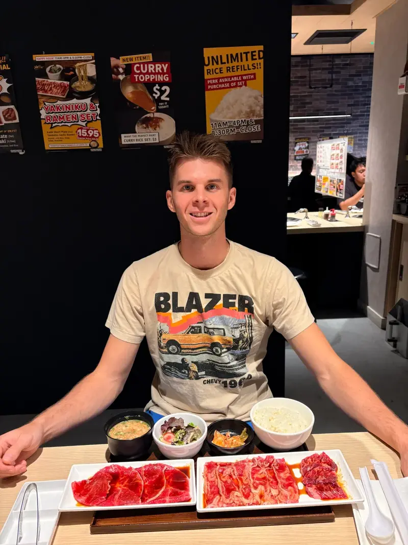 Nate at Yakiniku Like Hawaii with the Beef Lovers Set featuring three cuts of beef - Kalbi Short Plate, Misuji, and Harami