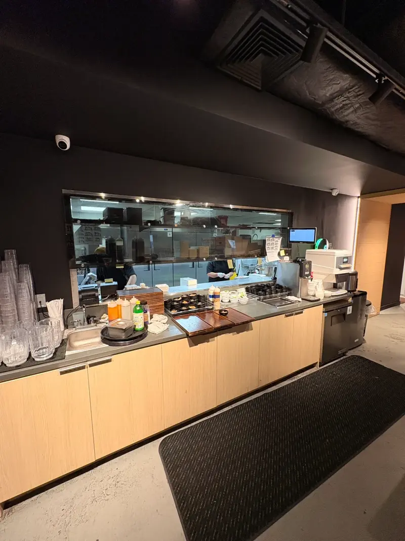 Yakiniku Like Hawaii open kitchen with staff preparing orders behind glass window