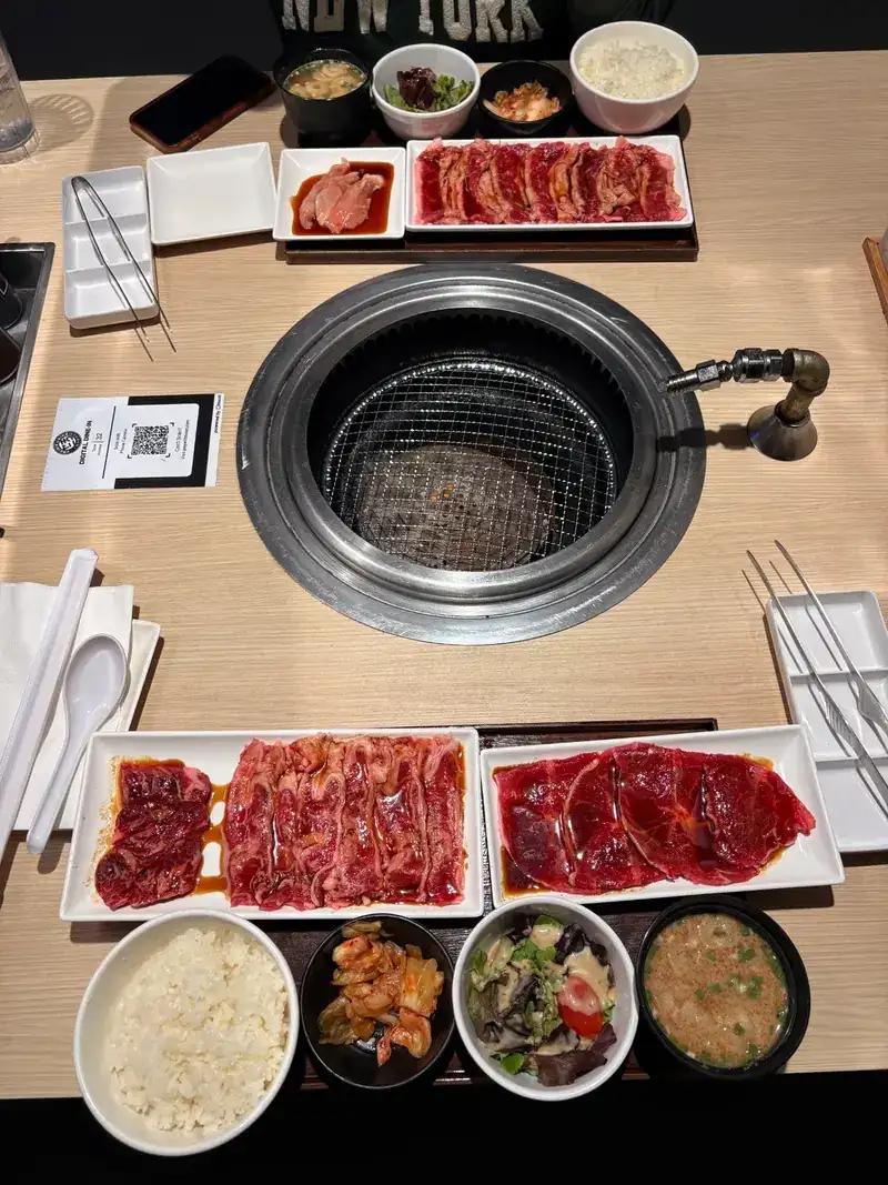 Yakiniku Like Hawaii table setup showing the Beef Lovers Set with rice, miso soup, salad, and kimchi